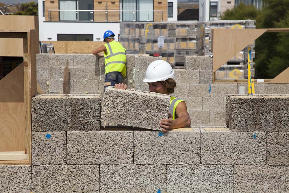 Construction worker Building with Durisol Insulated Concrete Form